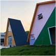 新型文旅民宿现代钢结构旅游景观房轻钢别墅造价图片